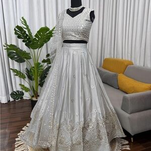 Elegant Silver Lehenga Choli in Japan silk fabric with heavy embroidery work